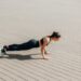 Woman in Black Tank Top and Black Leggings Doing Yoga